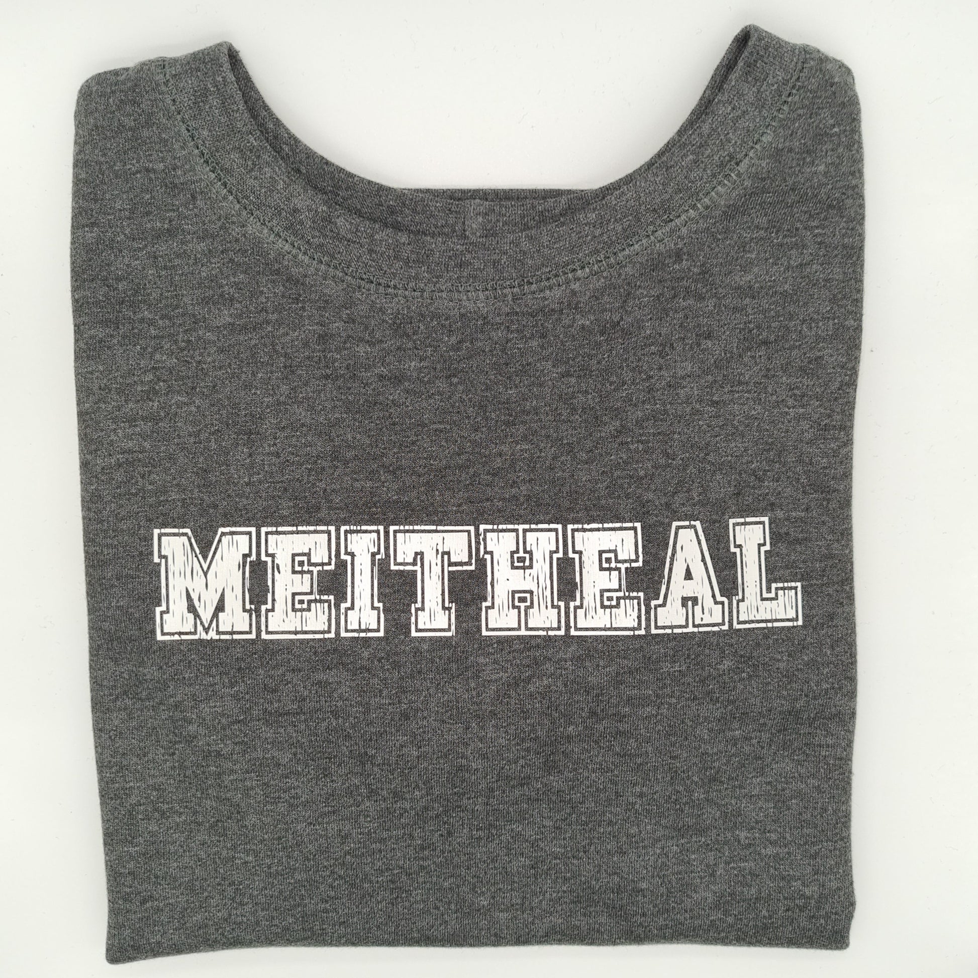 Folded grey sweatshirt with "MEITHEAL", in a varsity font, printed on it